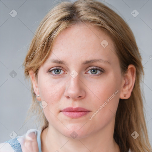 Joyful white young-adult female with medium  brown hair and blue eyes