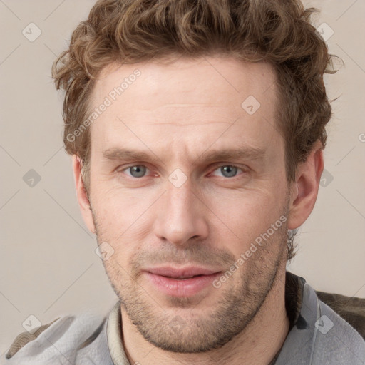 Joyful white adult male with short  brown hair and grey eyes