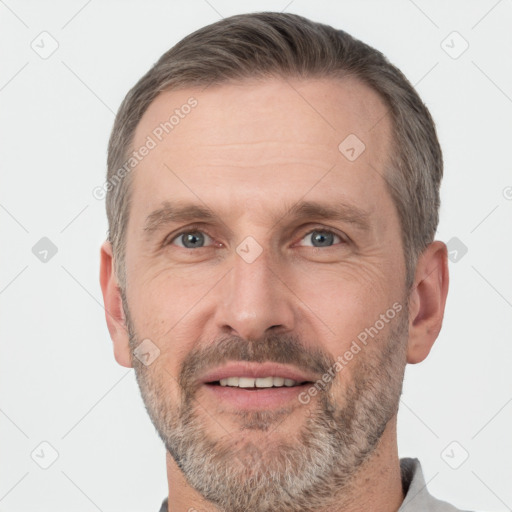 Joyful white adult male with short  brown hair and grey eyes