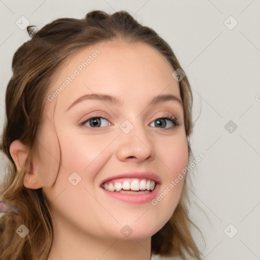 Joyful white young-adult female with long  brown hair and blue eyes