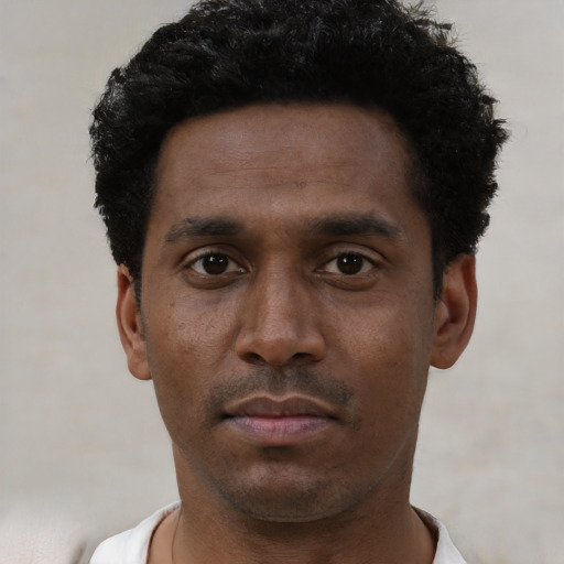 Neutral black young-adult male with short  black hair and brown eyes