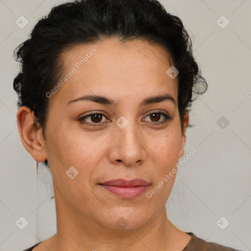 Joyful latino adult female with short  brown hair and brown eyes