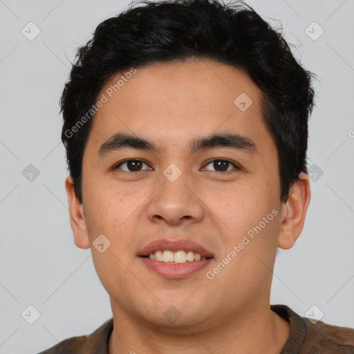 Joyful latino young-adult male with short  black hair and brown eyes