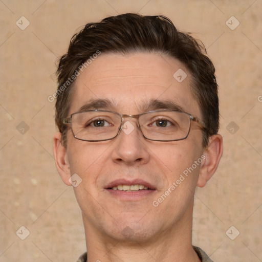 Joyful white adult male with short  brown hair and brown eyes