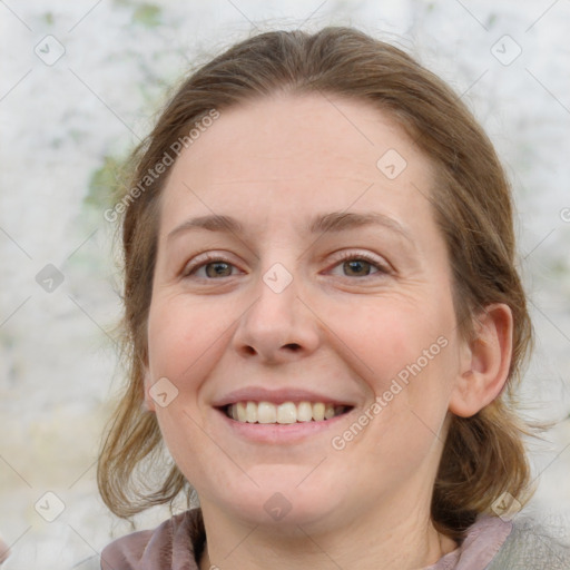 Joyful white young-adult female with medium  brown hair and blue eyes