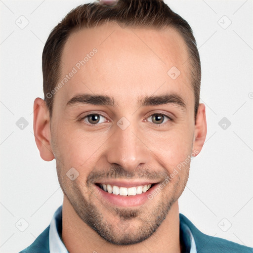 Joyful white young-adult male with short  brown hair and grey eyes