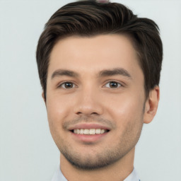 Joyful white young-adult male with short  brown hair and brown eyes