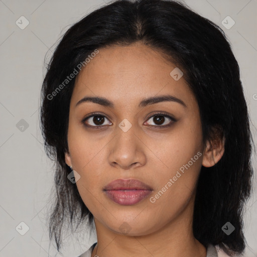 Joyful latino young-adult female with medium  black hair and brown eyes