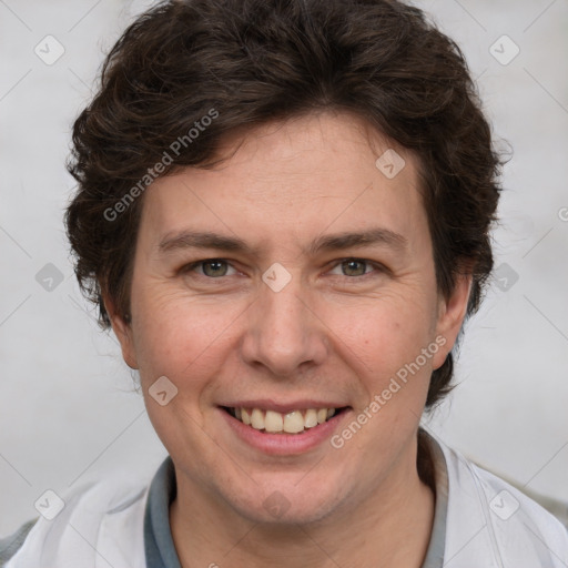 Joyful white adult female with short  brown hair and brown eyes