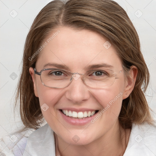 Joyful white adult female with medium  brown hair and blue eyes