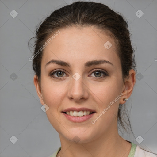 Joyful white young-adult female with medium  brown hair and grey eyes