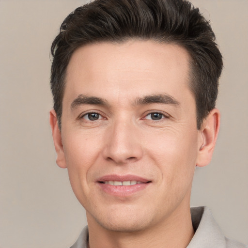 Joyful white young-adult male with short  brown hair and brown eyes