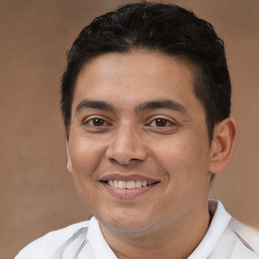 Joyful asian young-adult male with short  brown hair and brown eyes