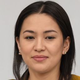 Joyful asian young-adult female with medium  brown hair and brown eyes