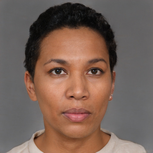 Neutral latino young-adult female with short  black hair and brown eyes
