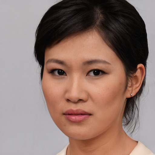 Neutral asian young-adult female with medium  brown hair and brown eyes