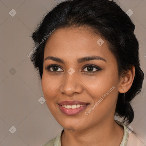 Joyful latino young-adult female with medium  brown hair and brown eyes