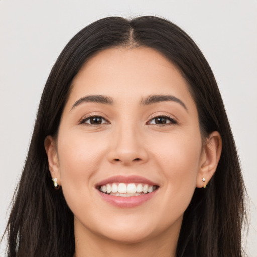 Joyful asian young-adult female with long  brown hair and brown eyes