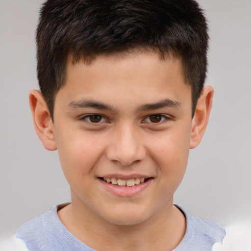 Joyful white child male with short  brown hair and brown eyes