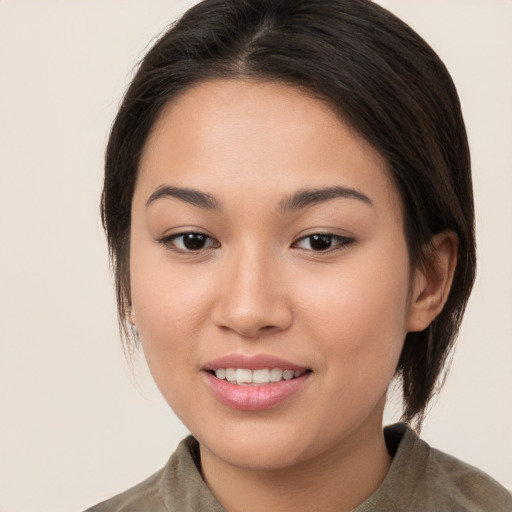 Joyful white young-adult female with medium  brown hair and brown eyes