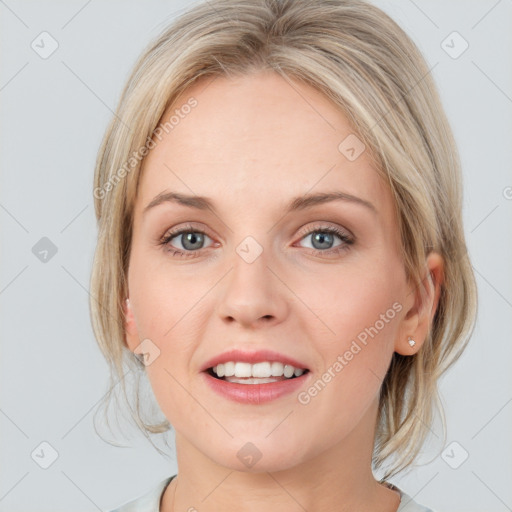 Joyful white young-adult female with medium  brown hair and blue eyes