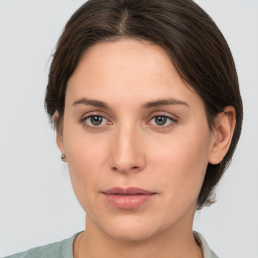 Neutral white young-adult female with medium  brown hair and brown eyes