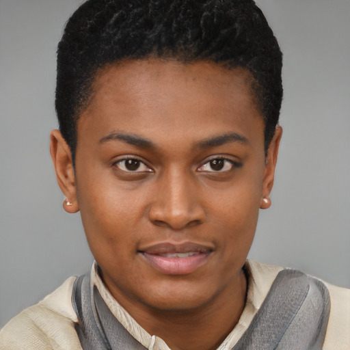 Joyful latino young-adult male with short  brown hair and brown eyes