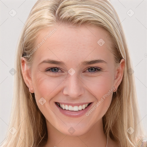 Joyful white young-adult female with long  brown hair and blue eyes