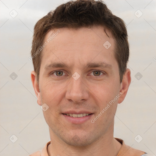 Joyful white adult male with short  brown hair and brown eyes