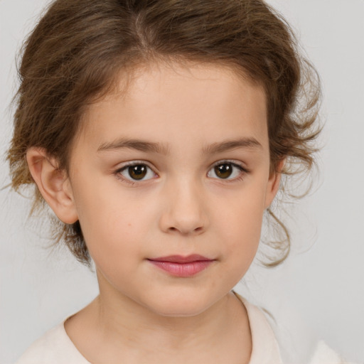 Joyful white child female with medium  brown hair and brown eyes