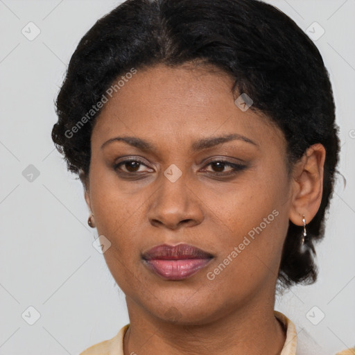 Joyful latino adult female with short  brown hair and brown eyes