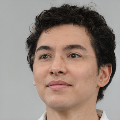 Joyful white young-adult male with medium  brown hair and brown eyes