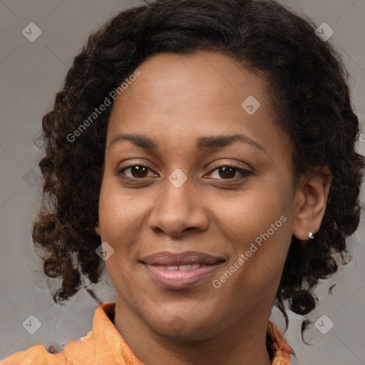 Joyful black young-adult female with medium  brown hair and brown eyes