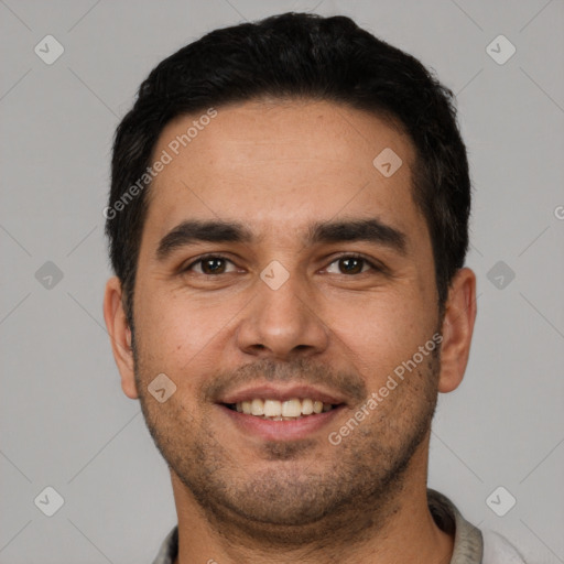 Joyful white young-adult male with short  black hair and brown eyes