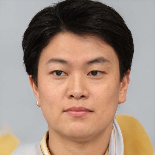 Neutral asian young-adult male with short  brown hair and brown eyes