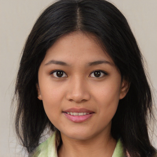 Joyful asian young-adult female with medium  brown hair and brown eyes