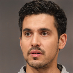 Neutral white young-adult male with short  black hair and brown eyes