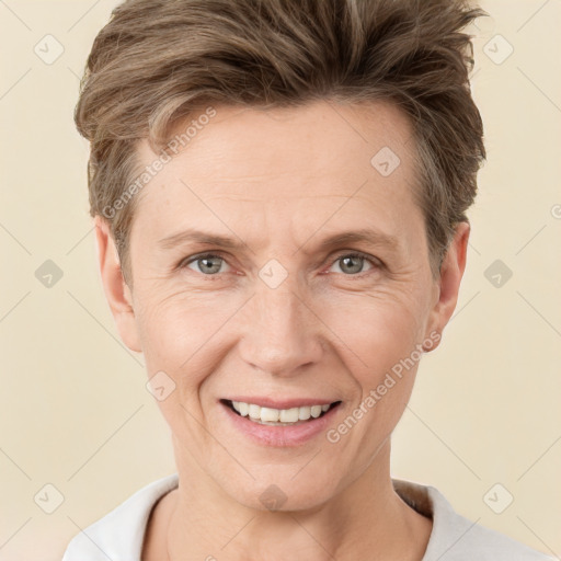 Joyful white adult male with short  brown hair and grey eyes