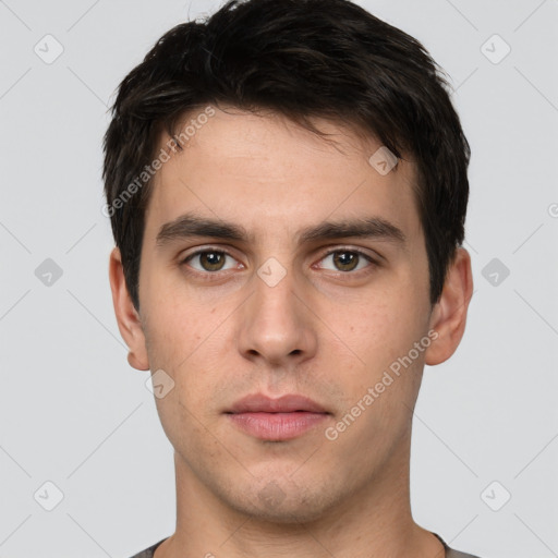 Neutral white young-adult male with short  brown hair and brown eyes