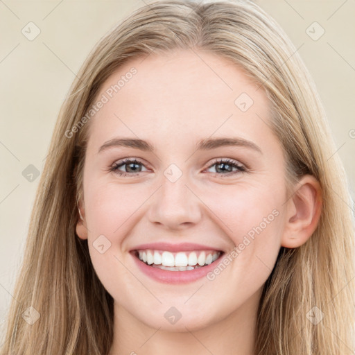 Joyful white young-adult female with long  brown hair and blue eyes