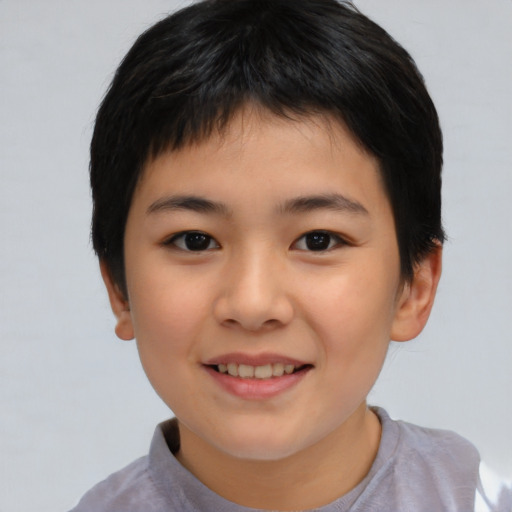 Joyful asian child female with short  brown hair and brown eyes