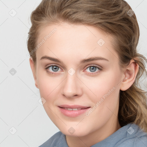 Joyful white young-adult female with long  brown hair and blue eyes