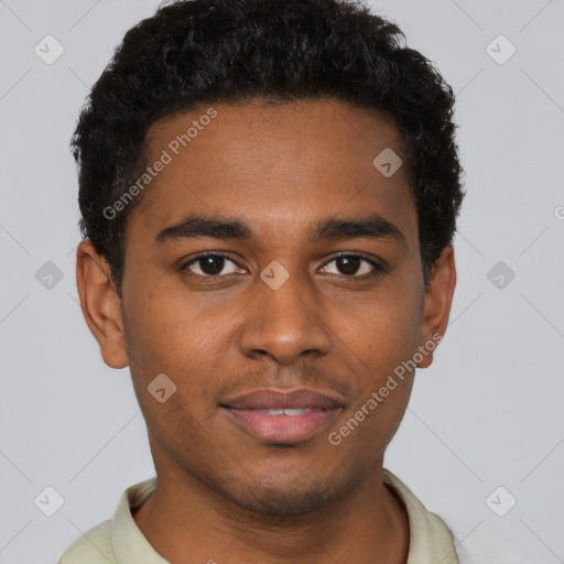 Joyful black young-adult male with short  brown hair and brown eyes