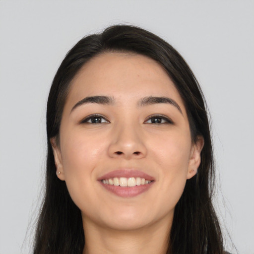 Joyful asian young-adult female with long  black hair and brown eyes