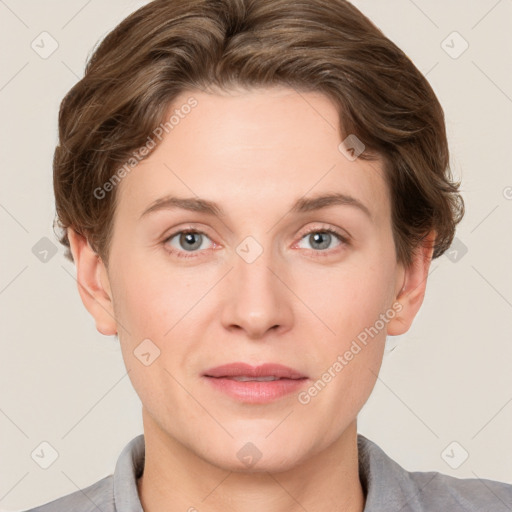 Joyful white adult female with short  brown hair and grey eyes