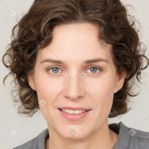 Joyful white young-adult female with medium  brown hair and blue eyes