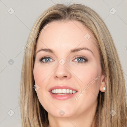 Joyful white young-adult female with long  brown hair and blue eyes