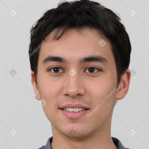 Joyful white young-adult male with short  black hair and brown eyes