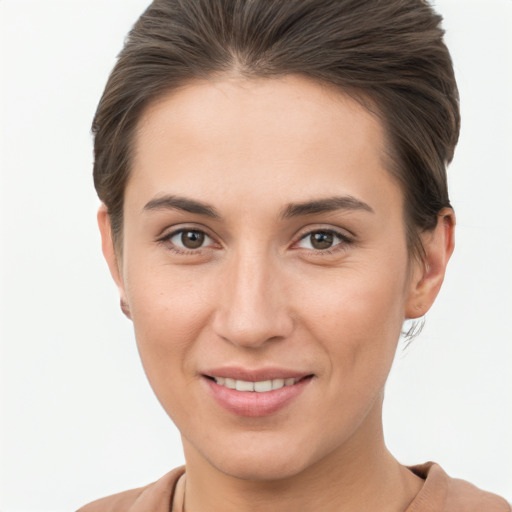 Joyful white young-adult female with short  brown hair and brown eyes