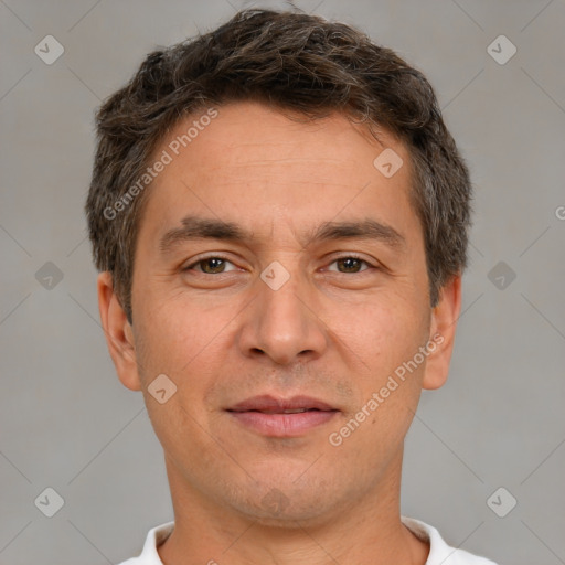 Joyful white adult male with short  brown hair and brown eyes